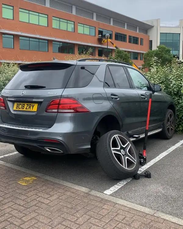 Mercedes GLE tyre replaced in an office car park